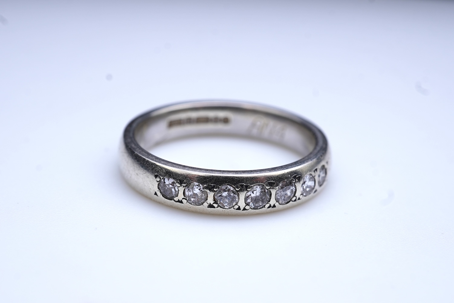 A diamond ring and two gold wedding rings